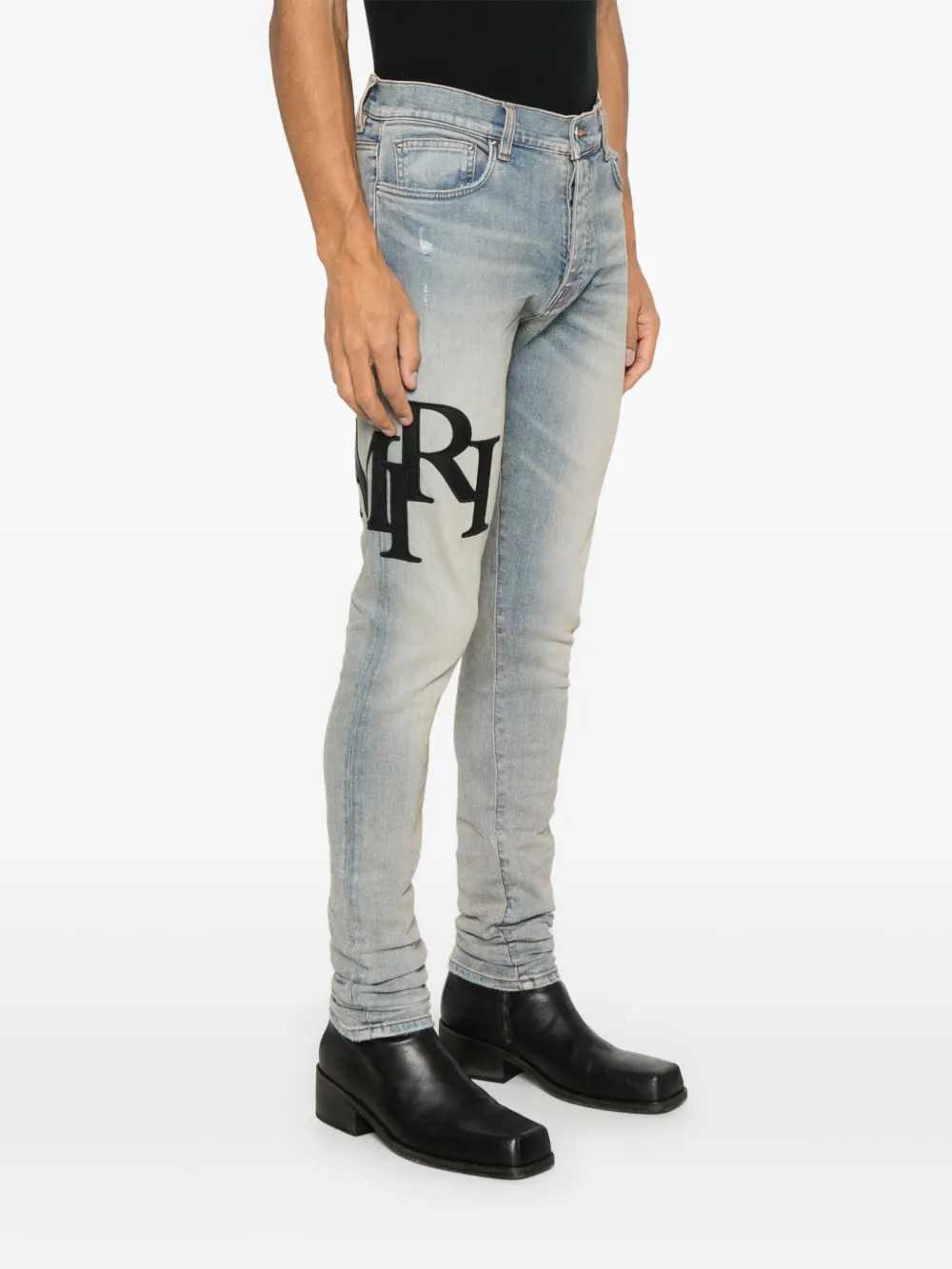 Amiri Men Skinny Jeans With Offset Logo - Black/Red AMIRI