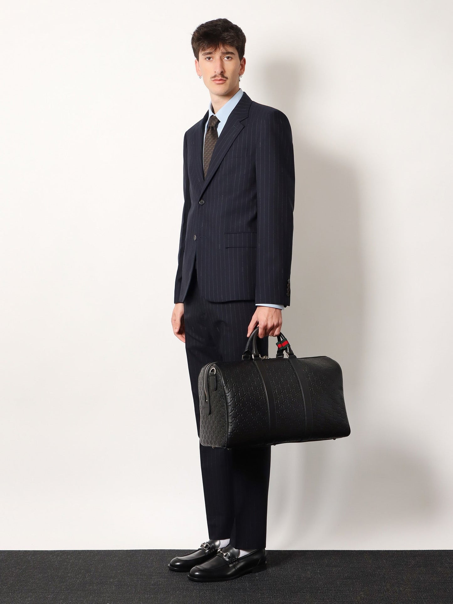 Gucci Men Coated Canvas Gg Emblem Travel Bag With Gg Motif GUCCI