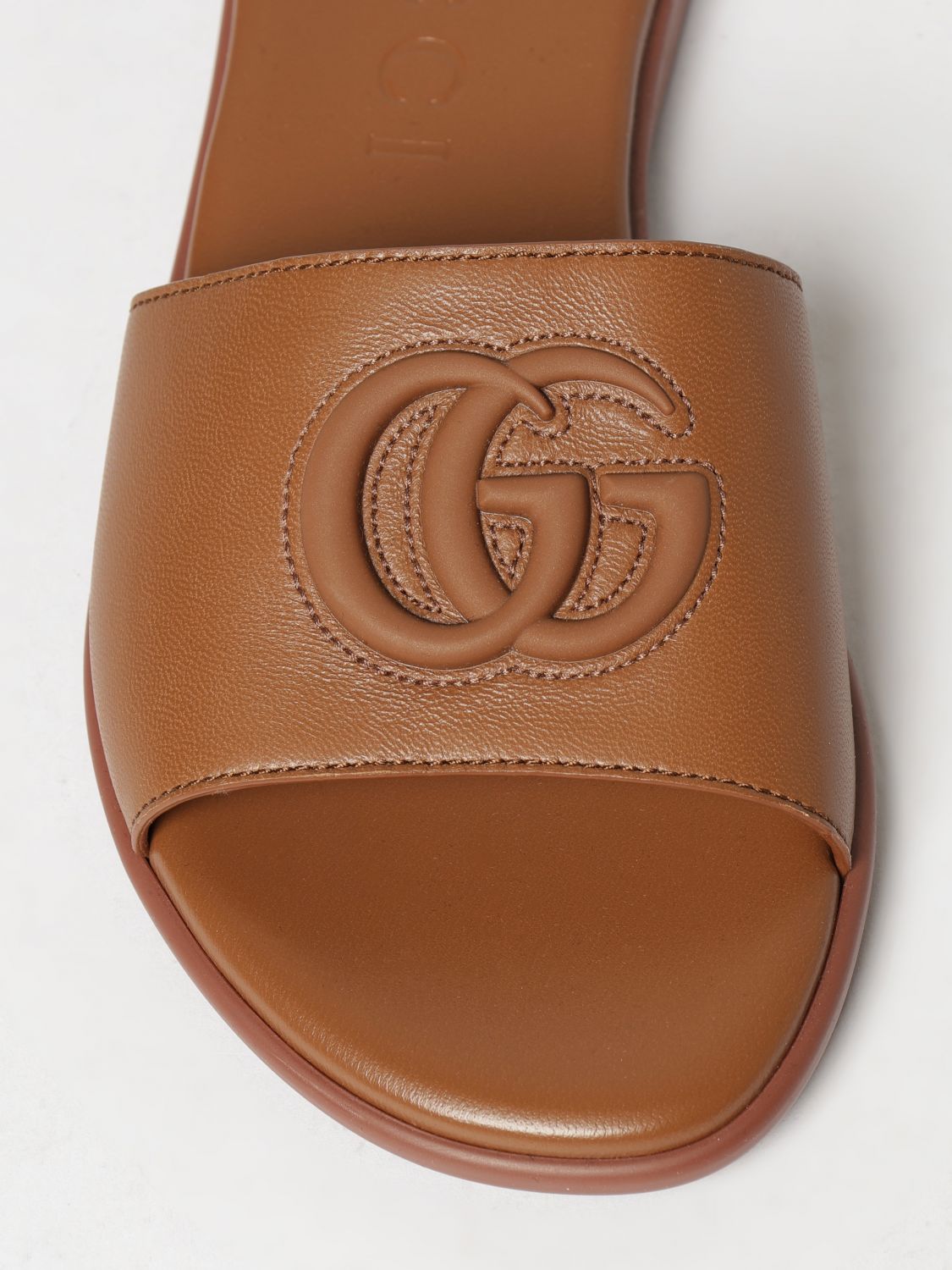 Gucci Women Gucci Calfskin Leather Slides With Embossed Gg Monogram GUCCI